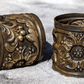 Antique Pair of Art Nouveau Floral Repousse Brass Napkin Serviette Rings - Tommy's Treasure